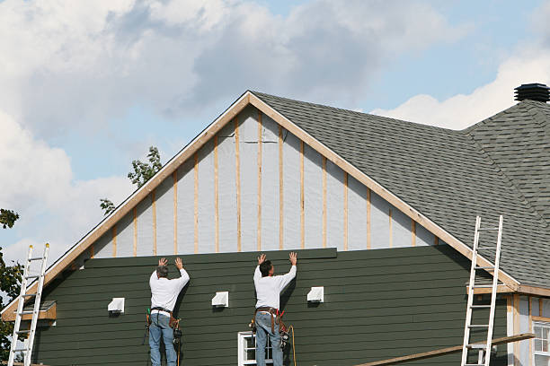 Professional Storm Damage Siding Repair technician working in Chevy Chase, MD